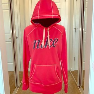 NIKE ThermaFit Tangerine Hoodie pocket & thumbhole